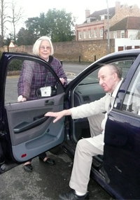 A volunteer driver takes a client to a medical appointment.