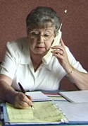 A volunteer duty officer takes a booking.