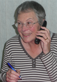 A volunteer Duty Officer takes a call from a Care client.